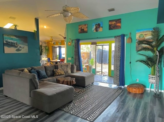 living room featuring wood-type flooring and ceiling fan