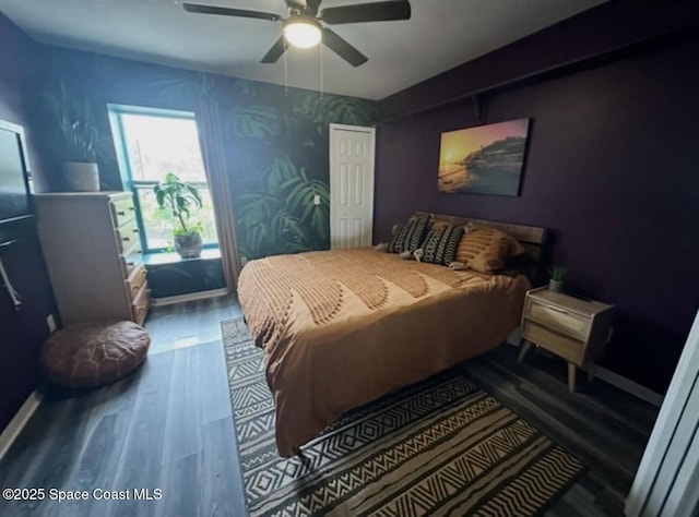 bedroom with a ceiling fan and wood finished floors