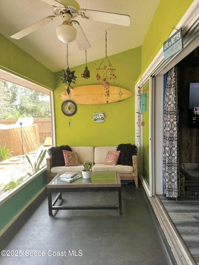 sunroom / solarium featuring vaulted ceiling and ceiling fan