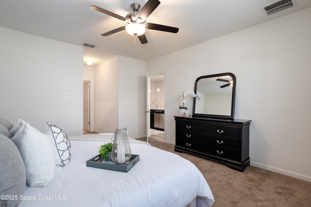 carpeted bedroom featuring ceiling fan and connected bathroom