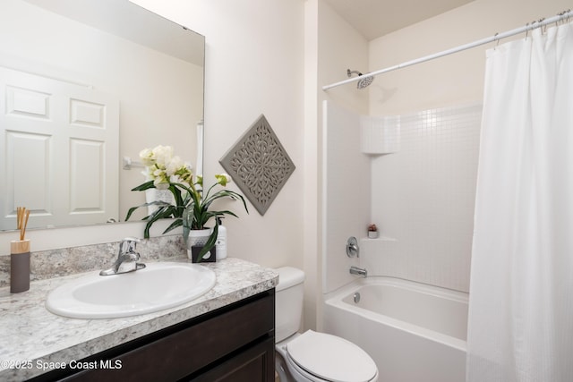 full bathroom featuring shower / bathtub combination with curtain, vanity, and toilet