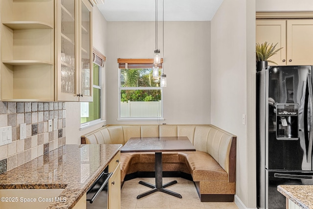 tiled dining space featuring breakfast area