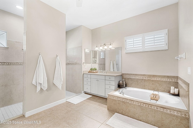 bathroom with vanity, tile patterned flooring, and independent shower and bath