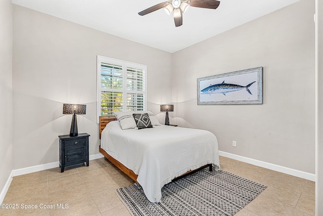 tiled bedroom featuring ceiling fan