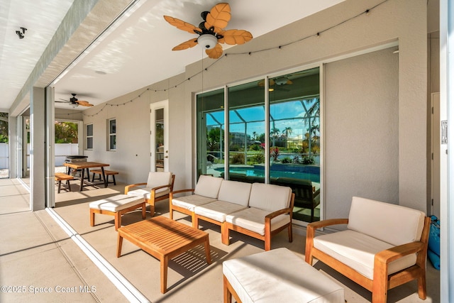 view of patio featuring outdoor lounge area and ceiling fan