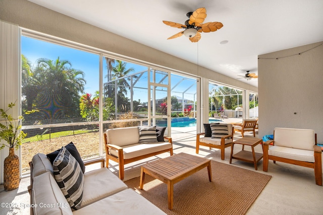 sunroom / solarium featuring ceiling fan