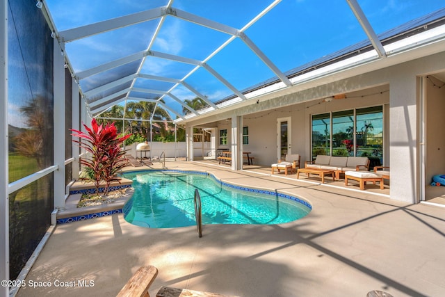 view of swimming pool featuring a lanai, a patio area, and outdoor lounge area