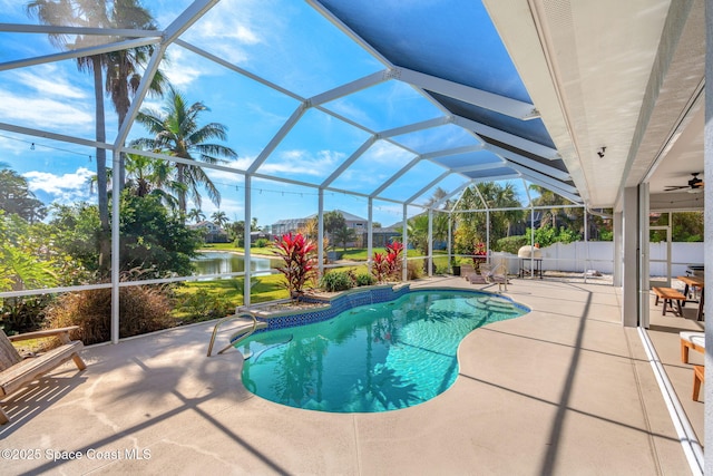 view of pool featuring a water view, a lanai, and a patio