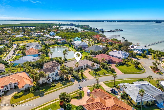 birds eye view of property featuring a water view