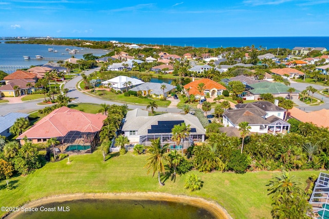 drone / aerial view with a water view