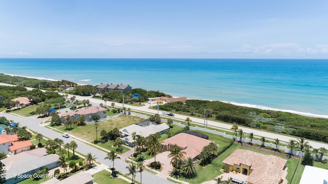 bird's eye view with a beach view and a water view