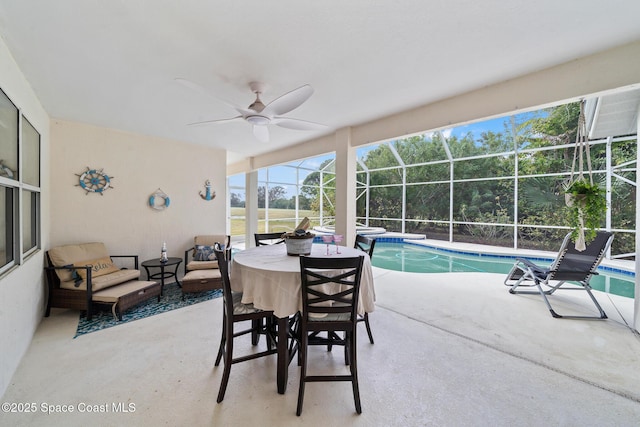 sunroom / solarium featuring ceiling fan