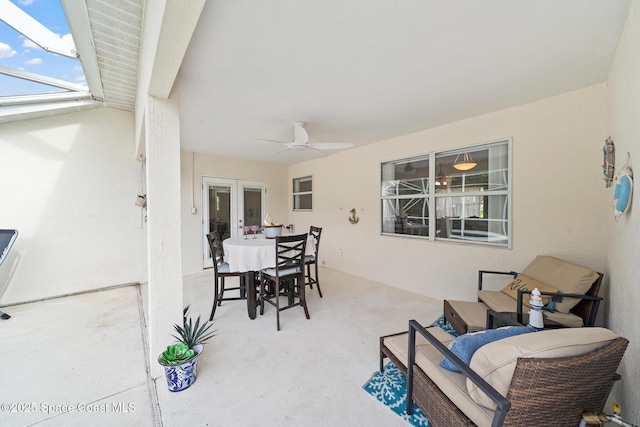 view of patio featuring french doors and ceiling fan