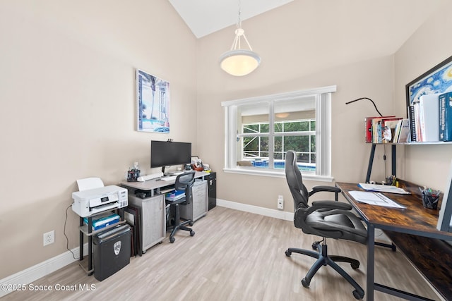 office area featuring lofted ceiling and light wood-type flooring