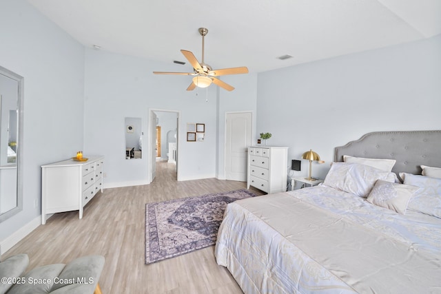 bedroom featuring ceiling fan, high vaulted ceiling, and light wood-type flooring