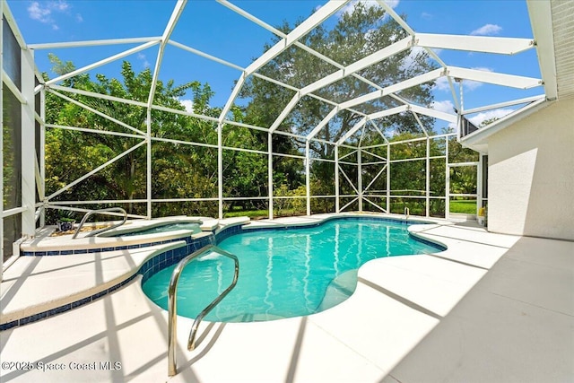 view of swimming pool with an in ground hot tub, a patio, and glass enclosure