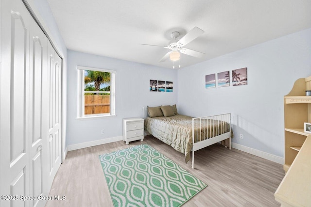 2631 Canterbury Cir, Rockledge, FL 32955 - bedroom with a closet, ceiling fan, and light hardwood / wood-style flooring