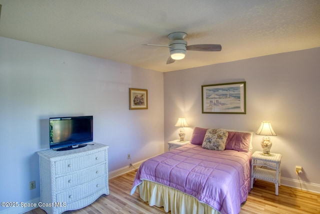 bedroom featuring ceiling fan and light wood-type flooring