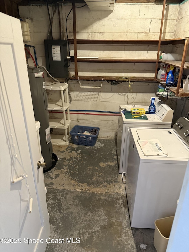 washroom with washer and clothes dryer and electric water heater