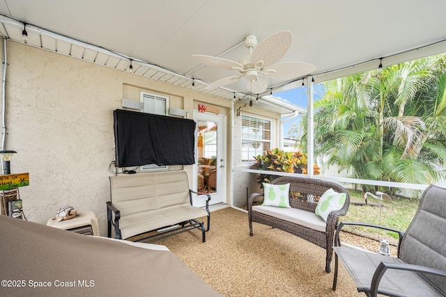 sunroom / solarium with ceiling fan