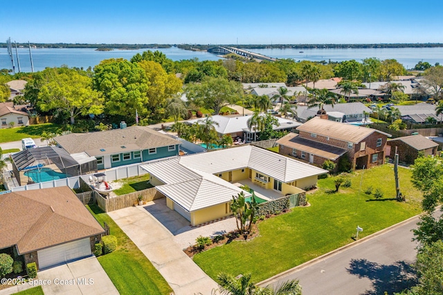 aerial view featuring a residential view and a water view