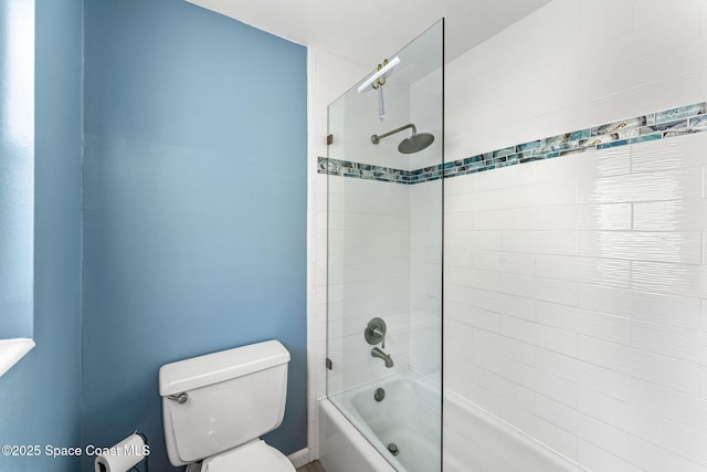 bathroom with shower / bathing tub combination and toilet