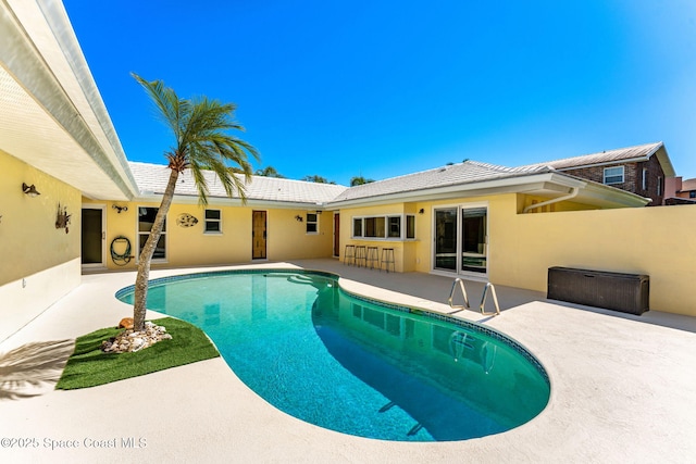 pool with a patio area