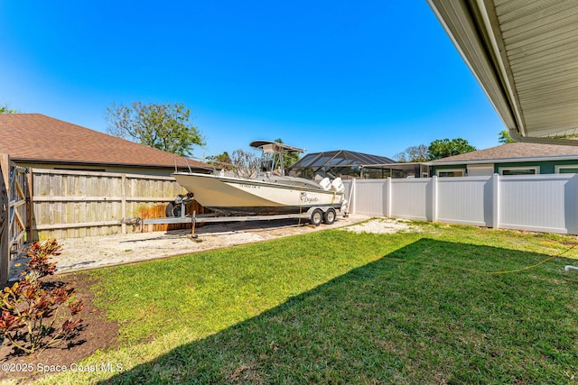 view of yard with a fenced backyard