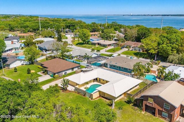 birds eye view of property with a residential view and a water view