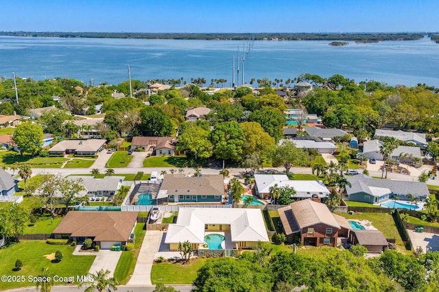 birds eye view of property featuring a residential view and a water view