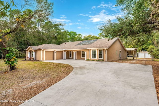 ranch-style house with solar panels