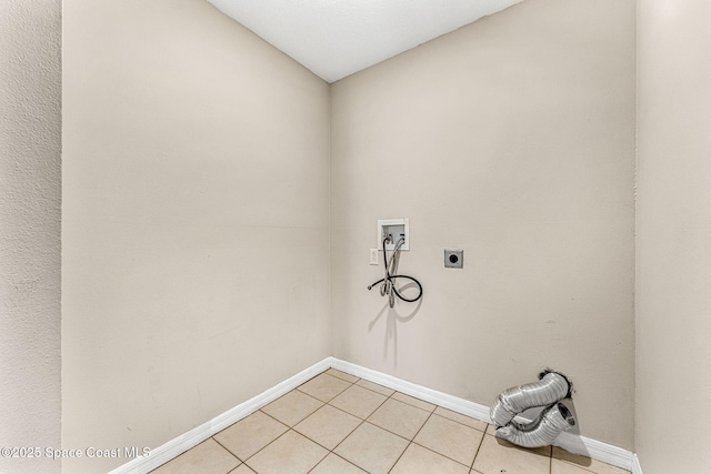 laundry room featuring washer hookup, hookup for an electric dryer, and light tile patterned floors