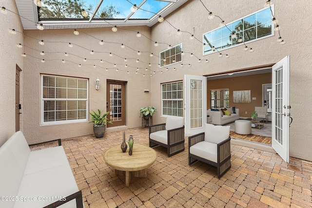 view of patio / terrace with an outdoor living space and french doors