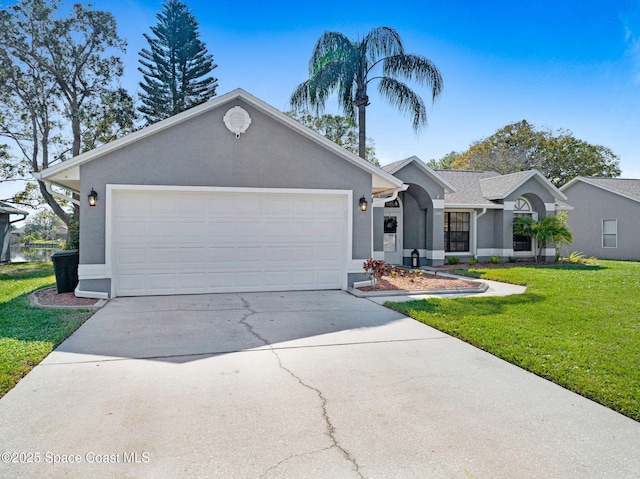 ranch-style home with a garage and a front lawn