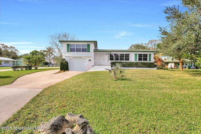 split level home with a garage and a front lawn