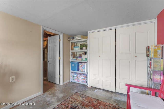 unfurnished bedroom featuring a closet and a textured ceiling