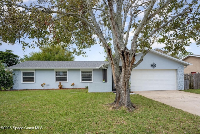 single story home featuring an attached garage, driveway, fence, and a front lawn