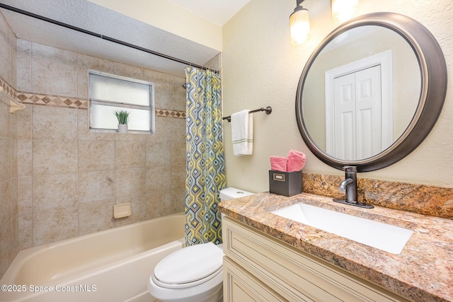 full bathroom with shower / bath combination with curtain, a textured wall, vanity, and toilet