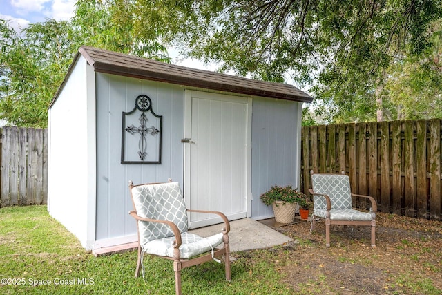 view of shed with a fenced backyard