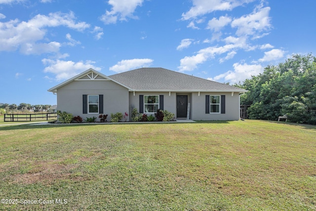 ranch-style house with a front lawn