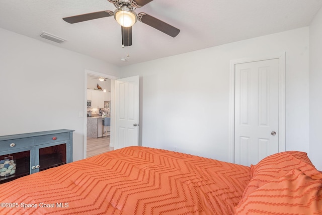 bedroom featuring ceiling fan