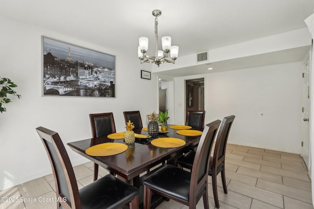 dining area with a notable chandelier