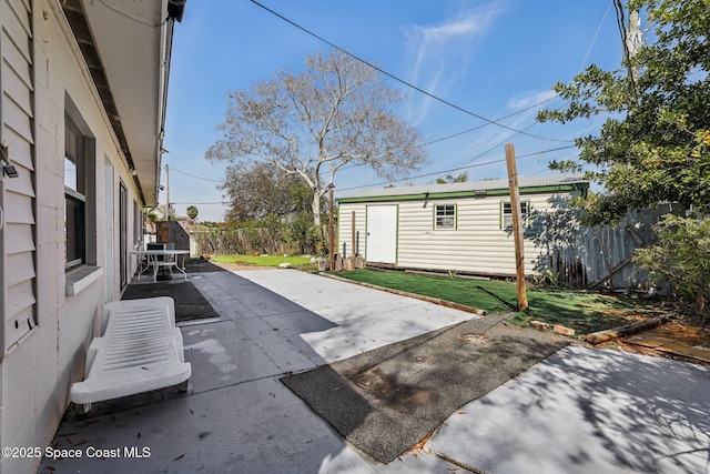 view of patio / terrace featuring an outbuilding