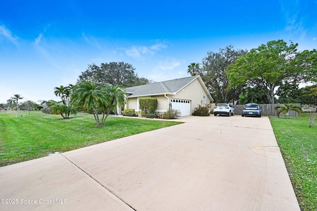 view of front of house featuring a garage and a front yard