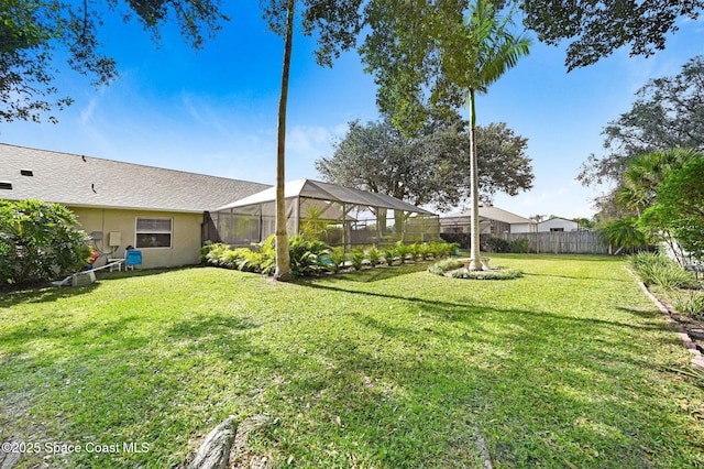 view of yard featuring a lanai