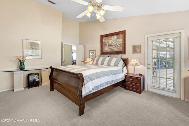 bedroom featuring vaulted ceiling, access to outside, light colored carpet, and ceiling fan