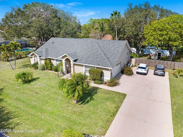 view of front of home featuring a garage and a front yard