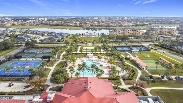 birds eye view of property with a water view