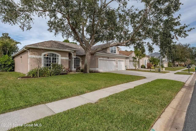 view of front of home with a garage and a front lawn