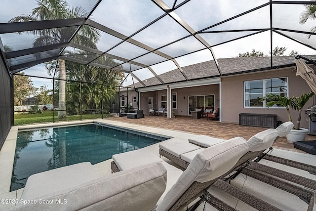 view of pool featuring a lanai, an outdoor hangout area, and a patio area